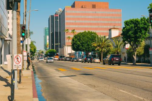 Los Angeles, California, USA - April 26, 2023.   Sunset Boulevard in West Hollywood on a bright sunny day. Architecture, traffic, city life