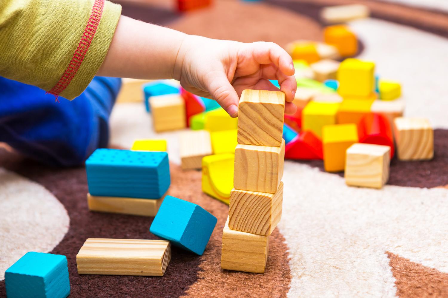 child playing with building blocks