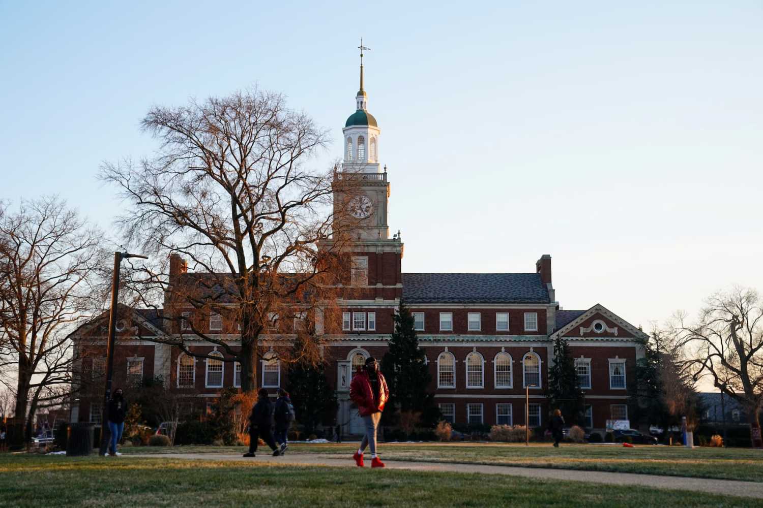 Students walk on the campus of Howard University, in Washington, U.S. January 31, 2022. REUTERS/Sarah Silbiger.
