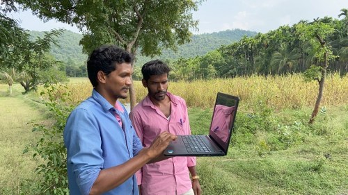 Residents of Sittlingi village check the internet connection on a laptop during the coronavirus pandemic in southern India.