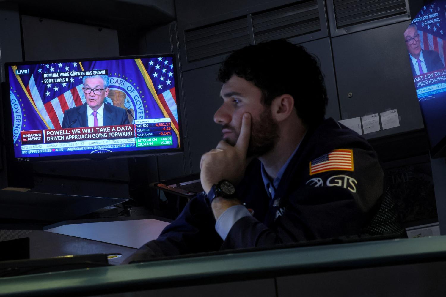 Traders react to Fed rate announcement on the floor of the NYSE in New York