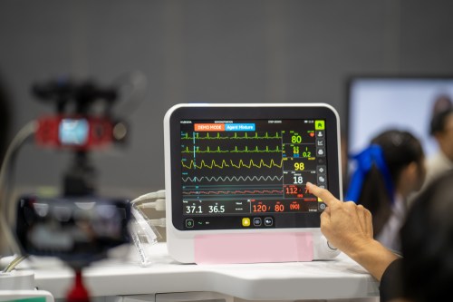Woman looking at a heart monitor