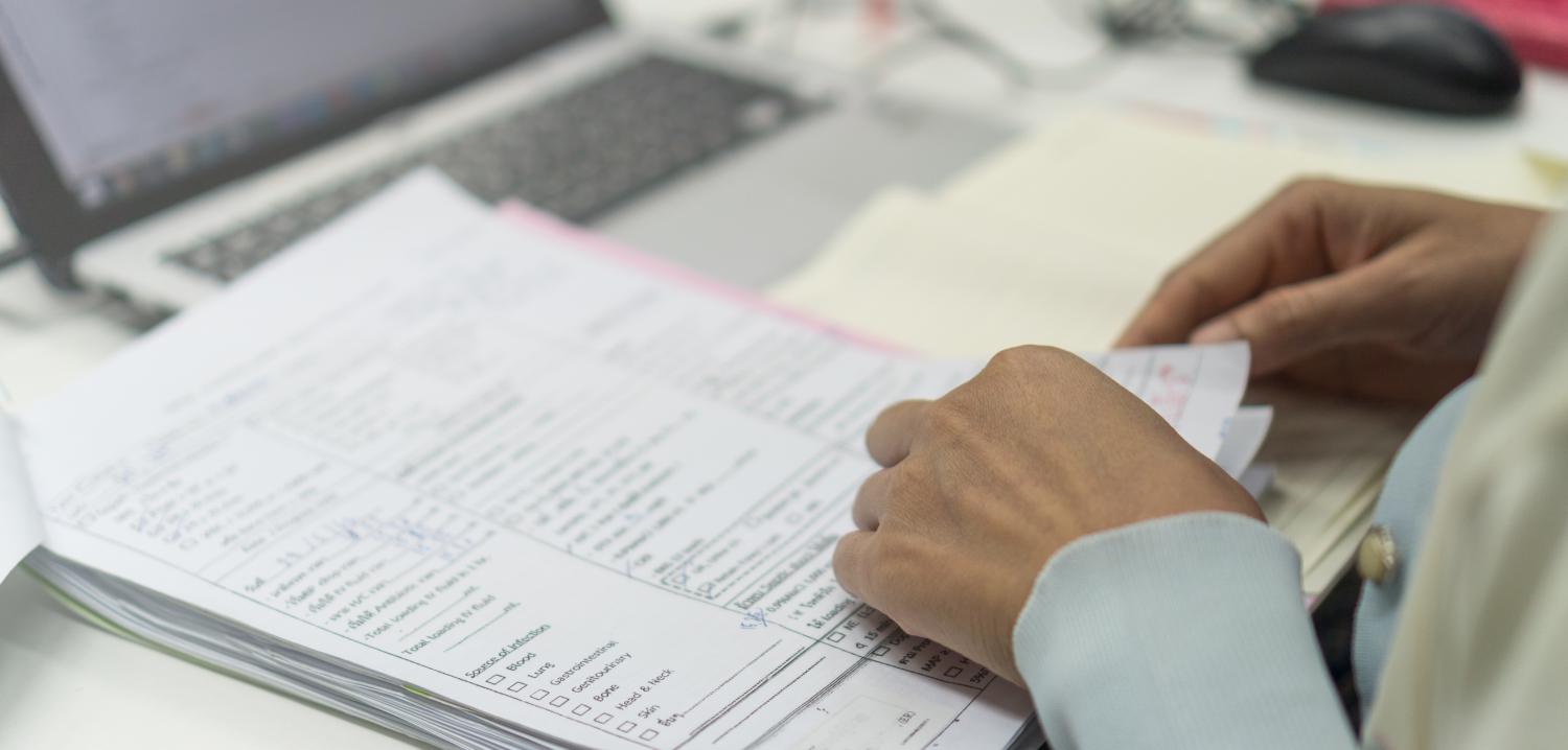 Doctor filling out paperwork