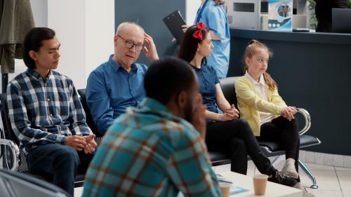 Health clinic waiting room with diverse patients