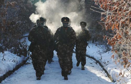 Soldiers of China's People's Liberation Army take part in training in temperatures below minus 30 degrees Celsius (minus 22 degrees Fahrenheit) at China's border with Russia in Fuyuan