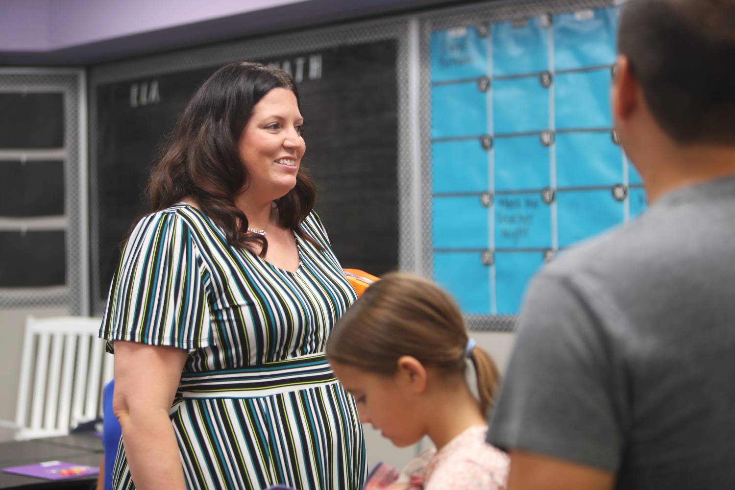 Fourth grade teacher Jessica Shmeckpeper meets parents and students at Kyrene de la Mirada Leadership Academy in Chandler on July 17, 2023.