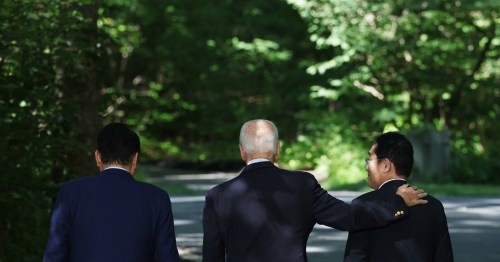 South Korean President Yoon Suk Yeol, U.S. President Joe Biden, and Japanese Prime Minister Fumio Kishida saunter away immediately follow the conclusion of a joint press conference after their trilateral summit meeting at the Camp David presidential retreat in Maryland, United States on August 18, 2023.