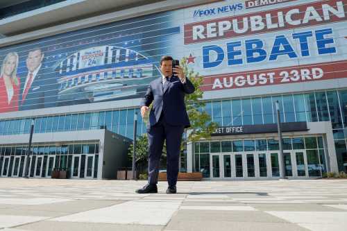 Fox News Host and debate moderator Bret Baier records a social media post outside the arena as preparations are underway for Republican U.S. presidential candidates to gather for their first primary debate of the 2024 campaign in Milwaukee, Wisconsin, U.S. August 22, 2023. REUTERS/Jonathan Ernst