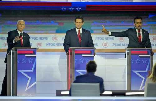 Republican presidential candidate former Vice President Mike Pence (left) and Republican presidential candidate Biotech entrepreneur Vivek Ramaswamy argue with Republican presidential candidate Florida governor Ron DeSantis in between at Fiserv Forum during the first 2023 Republican presidential debate in Milwaukee on Wednesday, Aug. 23, 2023. - Mike De Sisti / The Milwaukee Journal Sentinel ORG XMIT: MJS2308232147361535 (Via OlyDrop)