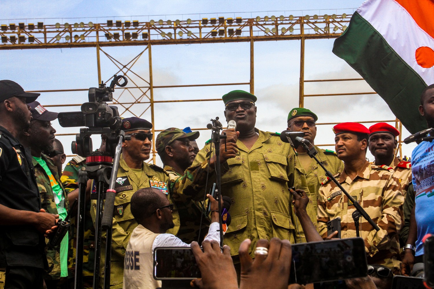 Members of a military council that staged a coup in Niger attend a rally at a stadium in Niamey, Niger, August 6, 2023.