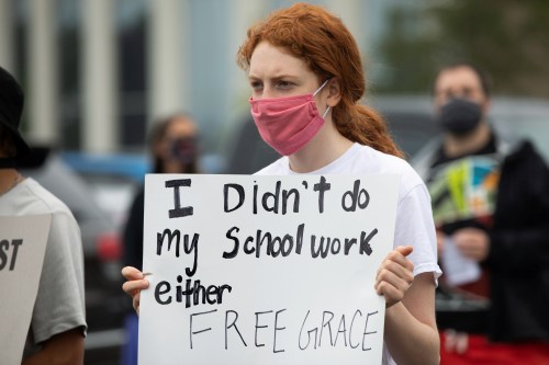 Students protest in support of a Black Groves High School student, who was jailed due to a probation violation of not keeping up with her online schoolwork, in front of the Oakland County Circuit Court and Prosecutors Office in the Detroit suburb of Pontiac, Michigan, U.S. July 16, 2020.