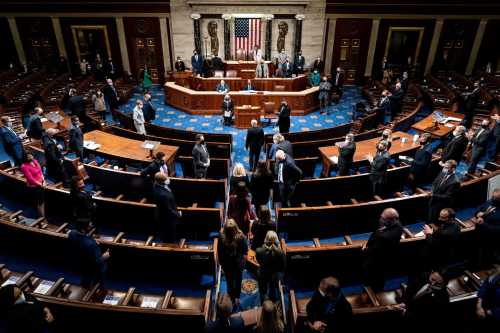 Electoral college votes are brought in before House Speaker Nancy Pelosi and Vice President Mike Pence resume presiding over a Joint session of Congress to certify the 2020 Electoral College results, after supporters of President Donald Trump stormed the Capitol earlier in the day, on Capitol Hill in Washington, U.S. January 6, 2021. Erin Schaff/Pool via REUTERS.