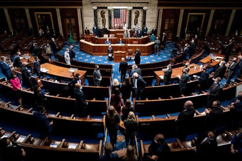 Electoral college votes are brought in before House Speaker Nancy Pelosi and Vice President Mike Pence resume presiding over a Joint session of Congress to certify the 2020 Electoral College results, after supporters of President Donald Trump stormed the Capitol earlier in the day, on Capitol Hill in Washington, U.S. January 6, 2021. Erin Schaff/Pool via REUTERS.