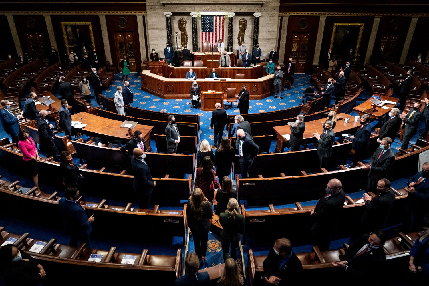Electoral college votes are brought in before House Speaker Nancy Pelosi and Vice President Mike Pence resume presiding over a Joint session of Congress to certify the 2020 Electoral College results, after supporters of President Donald Trump stormed the Capitol earlier in the day, on Capitol Hill in Washington, U.S. January 6, 2021.