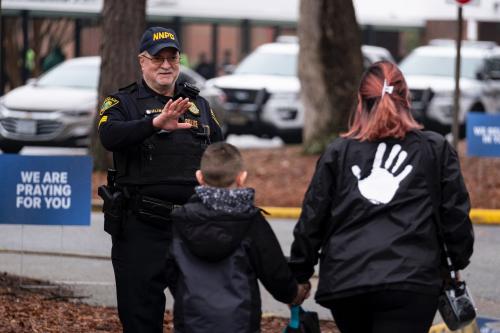 Sgt. Jamie Huling of the Newport News Police Department greets students as they return to Richneck Elementary in Newport News, Virginia, on Monday, Jan. 30, 2023, for the first time since a 6-year-old shot teacher Abby Zwerner three weeks prior. (Billy Schuerman/The Virginian-Pilot/TNS/ABACAPRESS.COM
