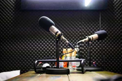 Podcast microphones stands in a recording studio on the premises of the company OMR. When the team from Hamburg-based media and digital company OMR calls, many decision-makers from global companies and celebrities don't ask twice. The OMR festival also brings so many people to the city that overnight accommodations become scarce.