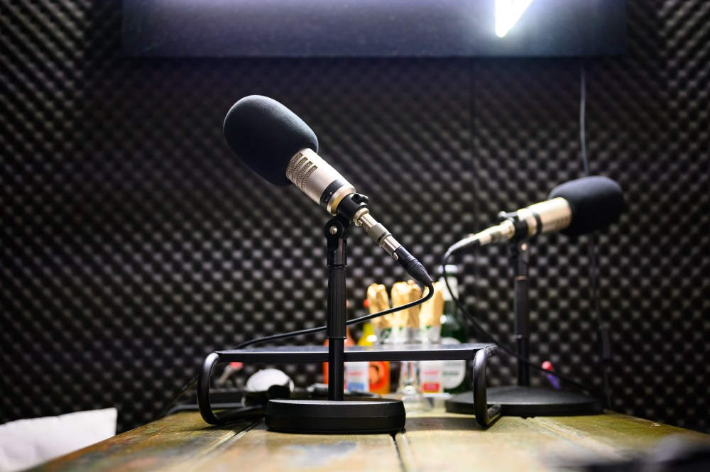 Podcast microphones stands in a recording studio on the premises of the company OMR. When the team from Hamburg-based media and digital company OMR calls, many decision-makers from global companies and celebrities don't ask twice. The OMR festival also brings so many people to the city that overnight accommodations become scarce.