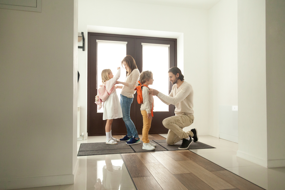 Parents getting children ready for school.