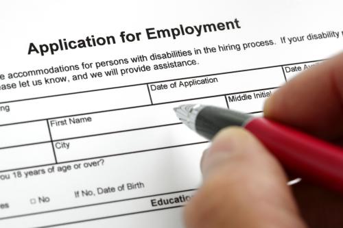 Person filling out a job application