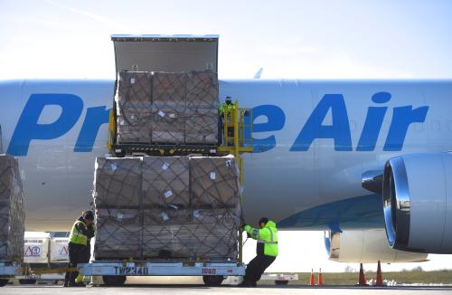 Workers unload a wide body aircraft emblazoned with Amazon's Prime logo at Lehigh Valley International Airport in Allentown, Pennsylvania, U.S.
