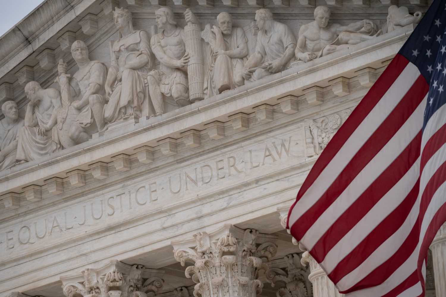 A detail view of the U.S Supreme Court and an American Flag, in Washington, D.C., on Friday December 10, 2021. REUTERS/Graeme Sloan/Sipa USA