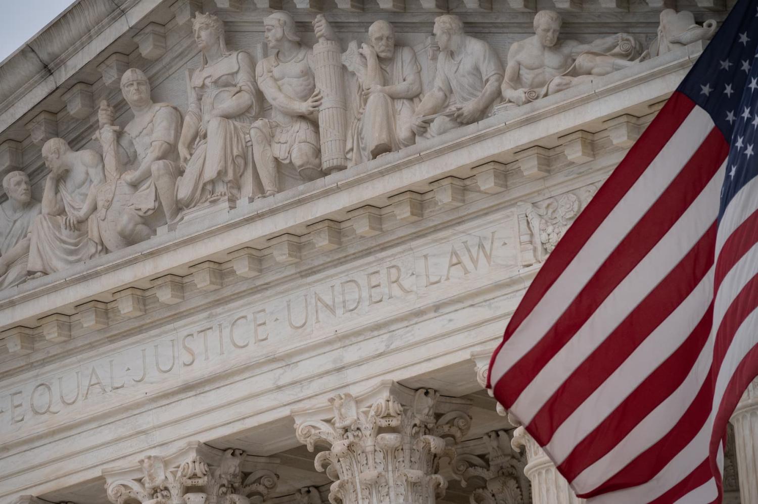 A detail view of the U.S Supreme Court and an American Flag, in Washington, D.C., on Friday December 10, 2021. REUTERS/Graeme Sloan/Sipa USA