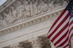 A detail view of the U.S Supreme Court and an American Flag, in Washington, D.C., on Friday December 10, 2021. REUTERS/Graeme Sloan/Sipa USA