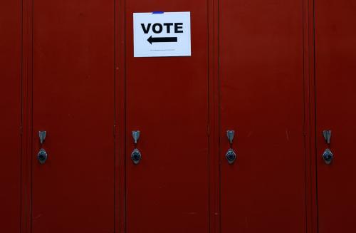 A sign points voters in the right direction for Wisconsin's Supreme Court election, at Milwaukee Marshall High School in Milwaukee, Wisconsin, U.S., April 4, 2023. REUTERS/Evelyn Hockstein