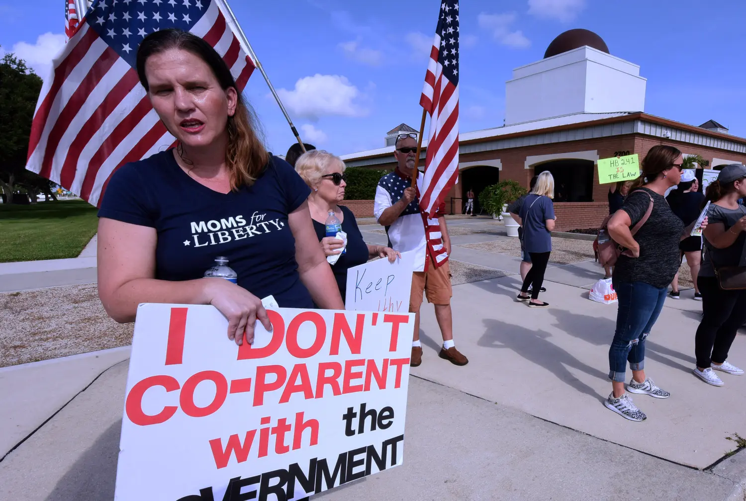 A member of Moms for Liberty protests against mandatory face masks for students during the COVID-19 pandemic at a meeting of the Brevard County School Board in Viera. The Southern Poverty Law Center (SPLC) is for the first time labeling Florida-headquartered Moms for Liberty and 11 other right-wing "parents' rights" groups as anti-government extremist groups in its annual report, released on June 6, 2023