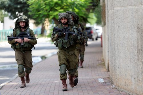 Israeli soldiers patrol following a mass-infiltration by Hamas gunmen from the Gaza Strip, in Sderot.