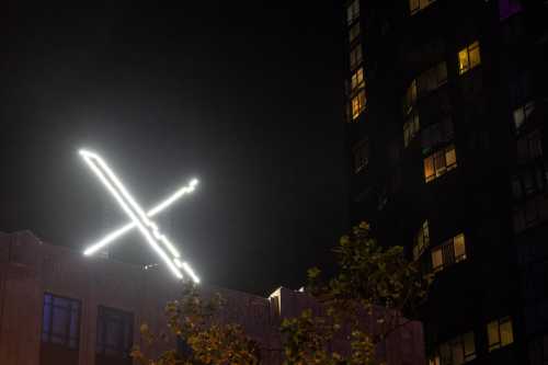 'X' logo is seen on the top of the headquarters of the messaging platform X, formerly known as Twitter, in downtown San Francisco, California, U.S., July 30, 2023. The European Commission has launched an investigation into Elon Musk's X social media platform to see whether it complies with new EU tech rules on illegal and harmful content following the spread of disinformation on its platform after Hamas' attack on Israel. REUTERS/Carlos Barria/ File Photo