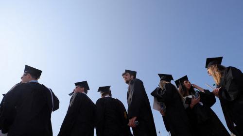 Graduating students gather for Commencement ceremonies at Boston College in Chestnut Hill, Massachusetts, U.S., May 22, 2023. REUTERS/Brian Snyder/File Photo