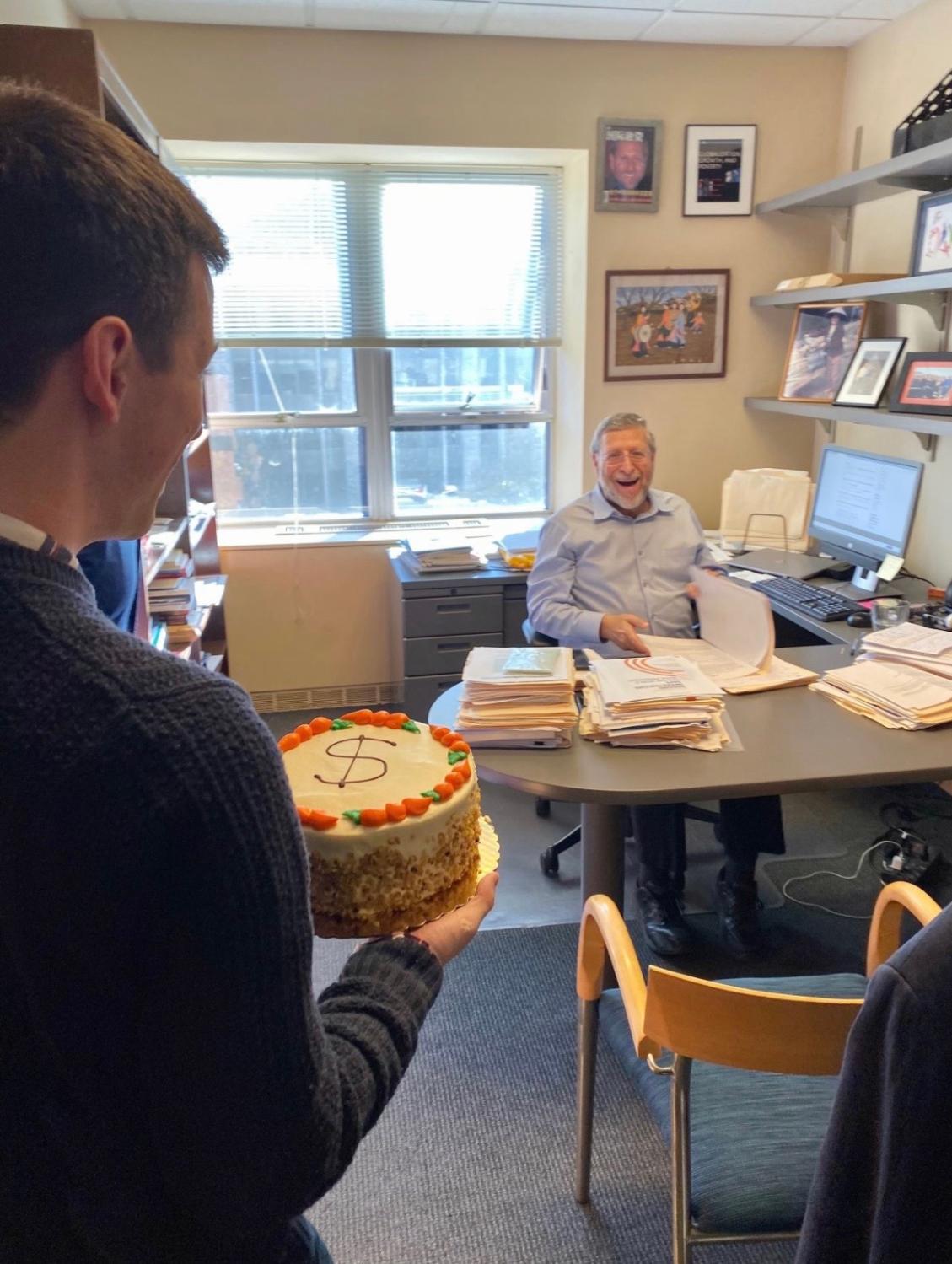 Surprising David Dollar with a surprise "birthday" cake on the one-year anniversary of the Dollar & Sense podcast.