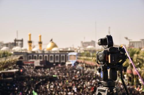A video camera is set up to record a protest in Iran.