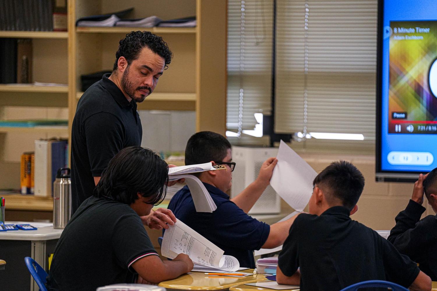 Math teacher Juan Arias helps a student at Mendez Middle School on Monday, Sep. 25, 2023.