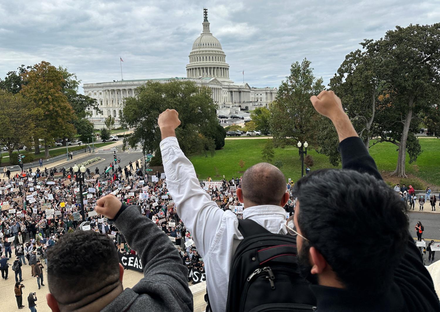 Protesters calling for a cease fire in Gaza and an end to the Israel-Gaza war demonstrate atop the steps of the Cannon House office building on Capitol Hill in Washington, U.S., October 18, 2023.