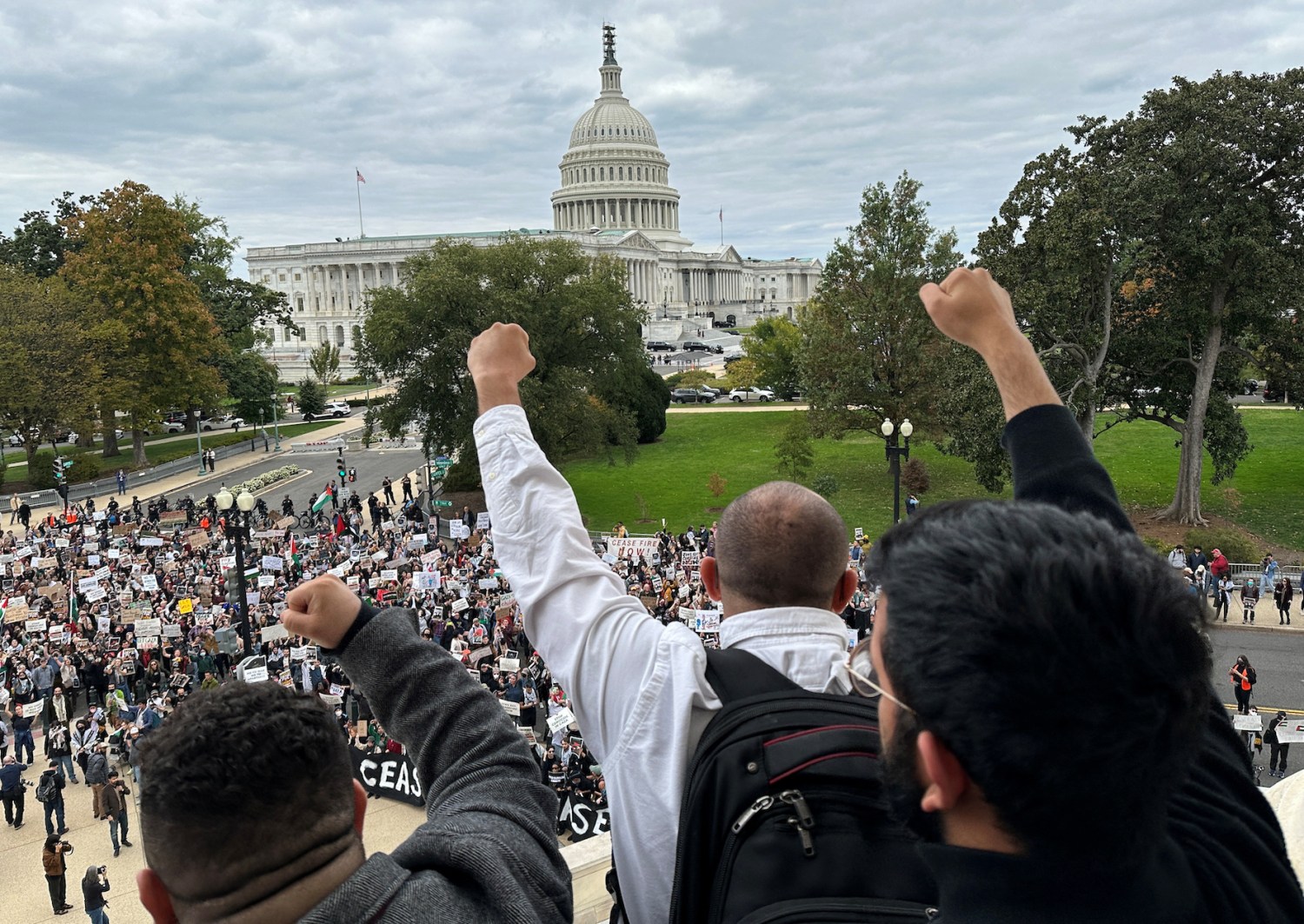 Protesters calling for a cease fire in Gaza and an end to the Israel-Gaza war demonstrate atop the steps of the Cannon House office building on Capitol Hill in Washington, U.S., October 18, 2023.