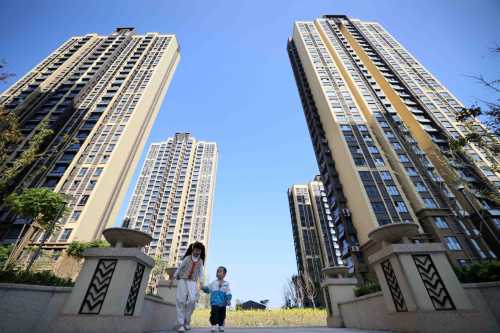 Children play in a residential area at a housing project in Hefei, Anhui province, China, November 1, 2023.