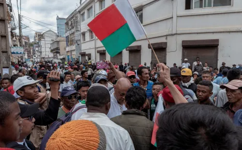 Madagascar's opposition member and presidential candidate Jean Jacques Ratsietison is surrounded by supporters after police fired tear gas to disperse demonstrators attending his rally, in Antananarivo, Madagascar. November 4, 2023.
