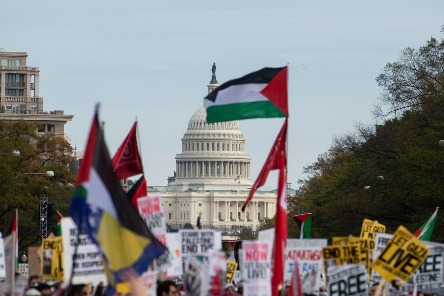 The U.S. Capitol is seen in the distance as thousands of anti-Israel protestors fill Freedom Plaza and the surrounding streets for a rally and march calling for an end to the Israel-Hamas war, in Washington, DC, USA, on Saturday, November 4, 2023.