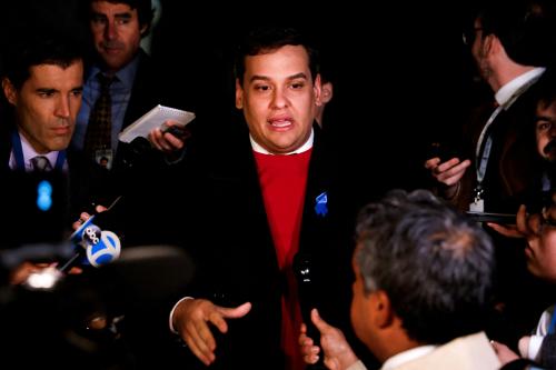 FILE PHOTO: U.S. Rep. George Santos speaks to members of the media after his Congressional colleagues voted not to expel him from the House