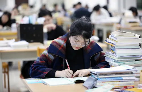 Students participating in the 2020 Postgraduate Admission Test, which is also known as National Postgraduate Entrance Examination, study at the library of the Northwest University, Xi’an city, northwest China’s Shaanxi province, 2 December 2020.