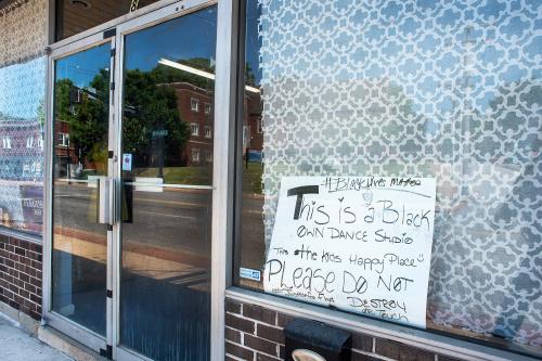 Ferguson, Missouri, USA, June 20, 2020 - black owned business sign on Ferguson Missouri business after police brutality protest riots following George Floyd's death, black lives matter,