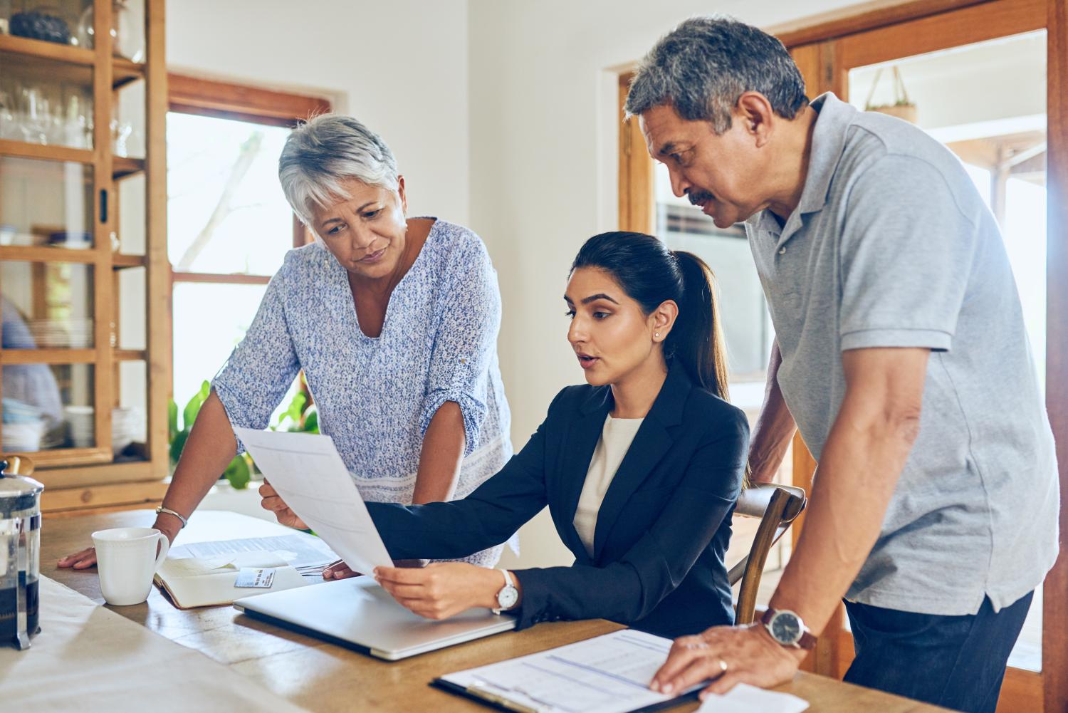 Shot of a mature couple getting advice from their financial consultant at home.