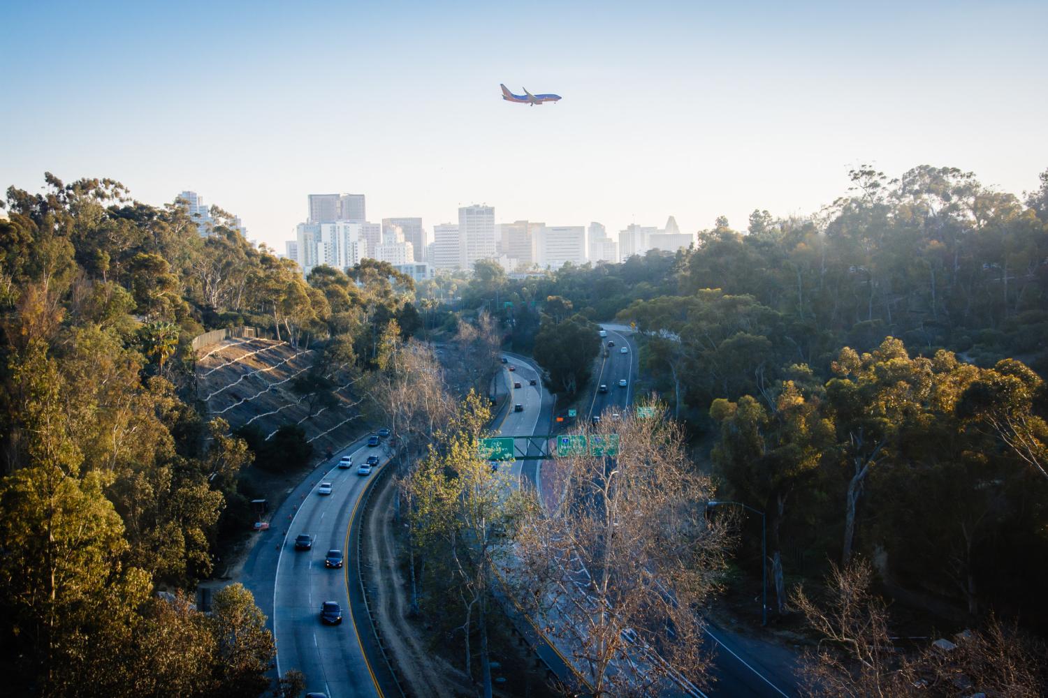Airplane landing over Route 163, San Diego, California.