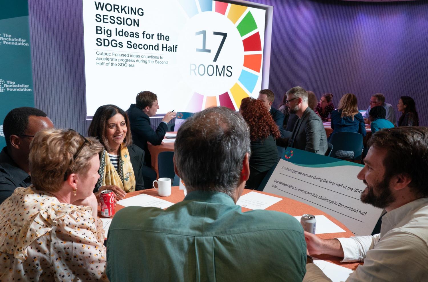 Participants discuss big ideas for the SDGs second half during the September 2023 17 Rooms community gathering. Featuring (from right to left): Duncan Kariuki, Allison Bellwood, Shaheen Kassim-Lakha, Roy Steiner, and Francois Souchet. Photo taken by Ralph Alswang (on behalf of The Rockefeller Foundation).