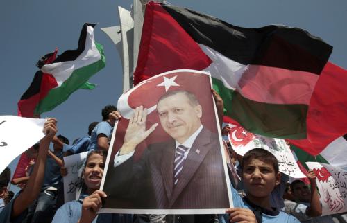 Palestinian schoolboys hold a poster depicting Turkey's Prime Minister Recep Tayyip Erdoğan during a rally at Gaza Seaport calling on Erdoğan to visit the Gaza Strip. September 13, 2011. REUTERS/Ismail Zaydah