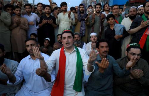 Supporters of Pakistan's former Prime Minister Imran Khan pray for Khan after the Supreme Court ruled that his arrest was illegal, in Peshawar, Pakistan, May 11, 2023. Reuters/Fayaz Aziz