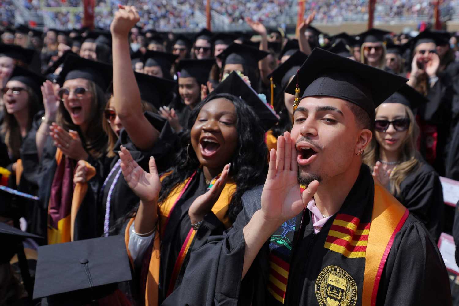 Graduating students cheer as they receive their degrees during Commencement ceremonies at Boston College in Chestnut Hill, Massachusetts, U.S., May 22, 2023. Credit: REUTERS/Brian Snyder