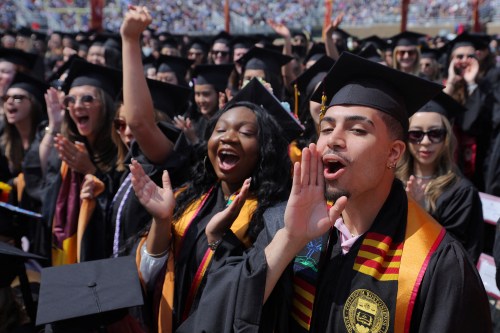 Graduating students cheer as they receive their degrees during Commencement ceremonies at Boston College in Chestnut Hill, Massachusetts, U.S., May 22, 2023.
